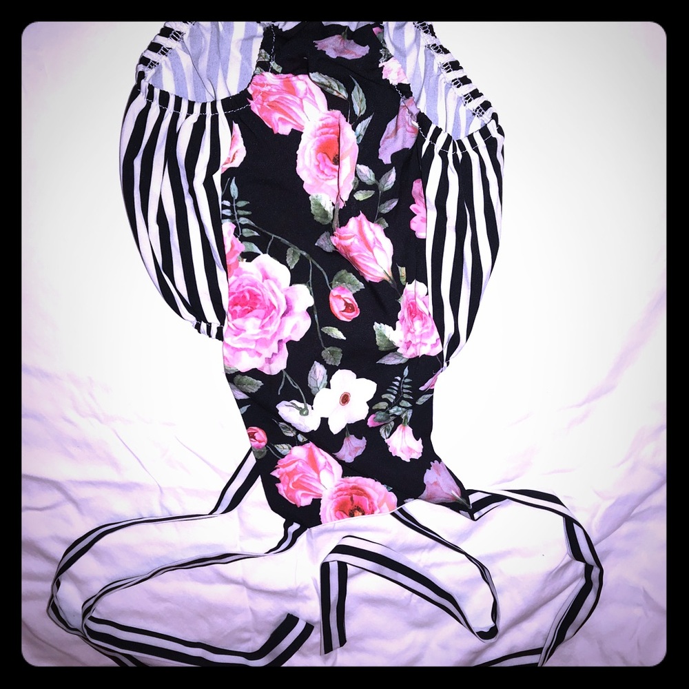 Brand new with tags, baby floral dress with snaps!